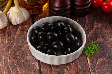 Mediterranean marinated Black olives in the bowl