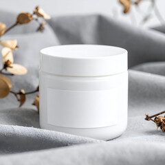 A minimalist white jar on soft fabric, ideal for skincare or cosmetic products.