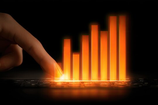 A hand touches a glowing orange bar graph on a dark keyboard - Powered by Adobe