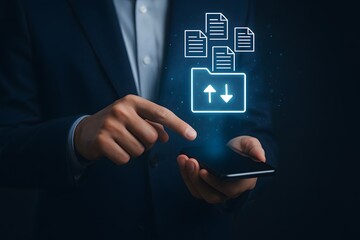 Businessperson using smartphone with glowing file transfer folder icon and document upload download symbols representing digital data management and cloud sharing