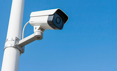 security camera on blue wall