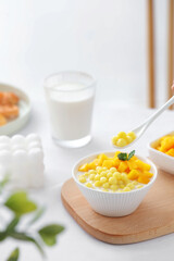 Small glutinous rice balls of different colors, mini balls made of flour, served with fruits or wolfberries