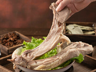 Fresh lamb ribs and traditional spices, kitchen scene