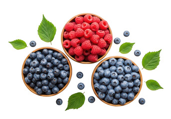 Three wooden bowls filled with fresh raspberries and blueberries with green leaves fruit raspberry