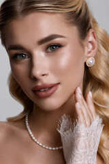 An Elegant Portrait Depicting a Beautiful Woman Adorned with Pearls and Intricate Lace