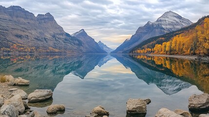 Serene mountain lake reflecting autumn hues