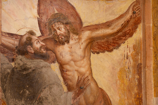 PIACENZA, ITALY - MAY 20, 2025: The fresco of stigmatisation of St. Francis of Assisi in church Basilica di San Francesco by unknown artist. 