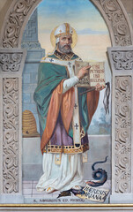 BOBBIO, ITALY - MAY 20, 2025: The fresco of St. Ambrose in Cathedral (Santa Maria Assunta) by Luigi Morgari from end of 19. cent.