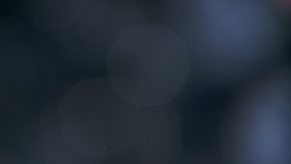 Real optical lens flare on black background