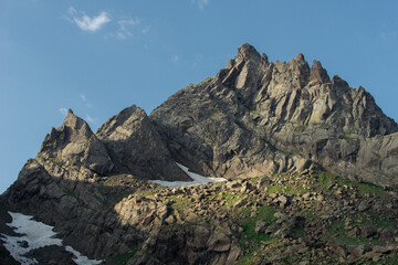 Rocky Mountain Cliff under Blue Dramatic Sky in Caucasus Montain