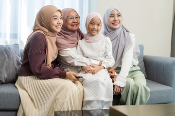 Four generations of muslim woman in hijab enjoying family time showing love, joy and happiness,...