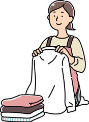 洗濯物をたたむお母さん