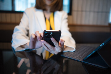 Businessman using on smartphone and tablet and laptop at office