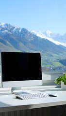 Desktop computer setup with mountain view for remote work and home office productivity