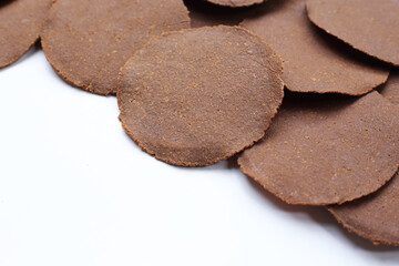 Fermented soybean discs, known as “Thua Nao,” a traditional Thai seasoning used to enhance flavor in Northern cuisine.