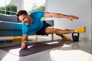 Man at home doing bodyweight interval workout