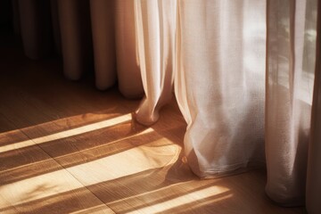 Sunlight streams through sheer curtains onto light wood floors