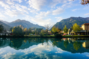 Aerial view over the city of Interlaken in Switzerland. Beautiful view of Interlaken town, Eiger, Monch and Jungfrau mountains and of Lake Thun and Brienz. Interlaken, Bernese Oberland, Switzerland