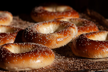 Freshly baked seeded bagels on a cooling rack in a bakery in the Mahane Yehuda market in Jerusalem.