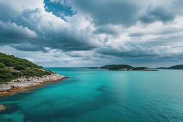 Serene Coastal Landscape with Crystal Clear Aquamarine Waters and Cloudy Skies