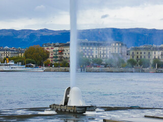 Base of the Geneva water jet with the lake and the city of Geneva, Switzerland in the background