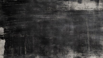 Dark textured surface with variegated marks.