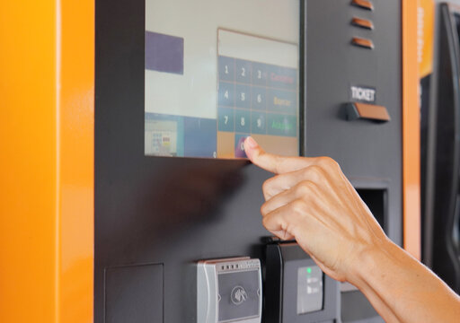 Travel and Transportation – Woman Typing Diesel Amount on Gas Pump Screen - Powered by Adobe
