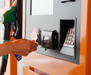 Travel and Transport – Woman Paying with Credit Card at Gas Pump Screen
