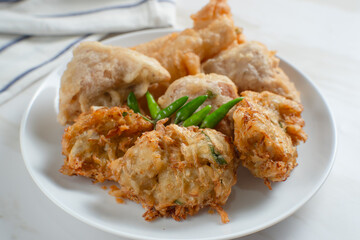 Gorengan is a general term for a large group of Indonesian fried snacks that can be prepared with a variety of ingredients, such as bakwan (fried vegetables), tofu, and risol (fried rice cakes).