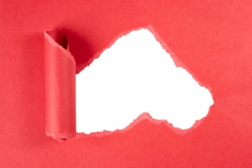ripped hole in red paper with rolled edge isolated on white or transparent png