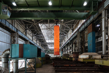 Hardening of pipe in special furnace, hot iron pipe on crane