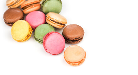 Macarons, macaroons, colorful assortment border design, vibrant pink, yellow, green, brown French pastries creamy fillings, macaroon isolated on white background, gourmet dessert