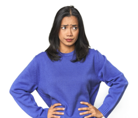 Simple portrait of a young Latina confused, feels doubtful and unsure.