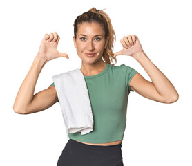 Young Caucasian female athlete in studio feels proud and self confident, example to follow.
