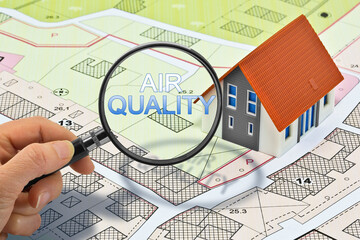 OUTDOORS AIR POLLUTANTS SEEN THROUGH A MAGNIFYING GLASS - Polluted outdoor air concept with...