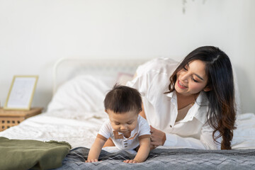 Asian mother play with baby at home, family love and joyful parenting, early childhood development, newborn care, motherhood support, baby insurance, prenatal course and maternal nutrition, mother day