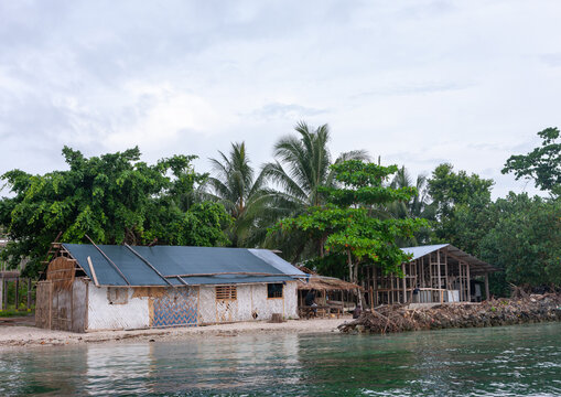 Protection against rising sea levels in a costal village, Autonomous Region of Bougainville, Bougainville, Papua New Guinea