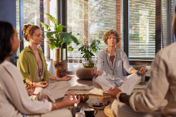 Wellness meditation in group at gym