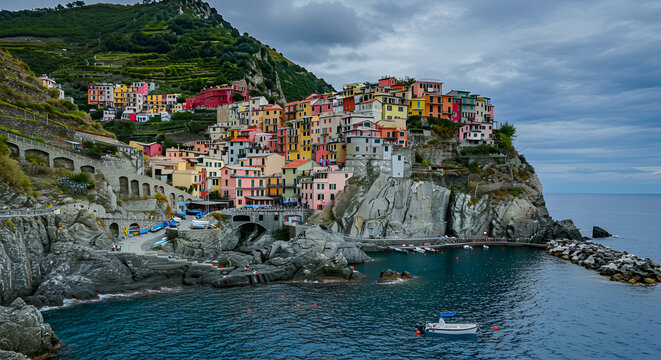 Coastal village with colorful houses built on rocky cliffs - Powered by Adobe