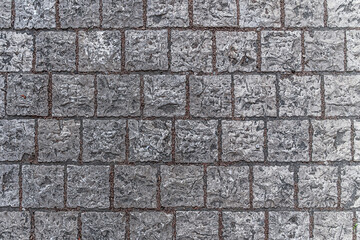 abstract background of grey stone tiled walkway in the park top view