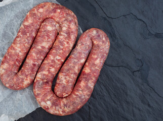traditional south African boerewors on a black slate surface