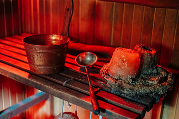 Close-Up of Sauna Candle and Ladle with Warm Lighting