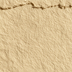 Close-up of torn kraft paper with rough edges. Natural beige texture ideal for backgrounds, eco design, scrapbooking, packaging, or handmade crafts