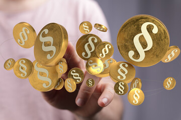 Abstract 3D rendering of golden coins with paragraph symbols, representing law, justice, and legal...