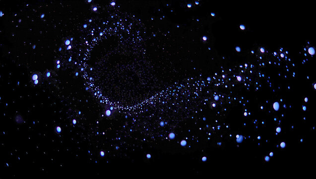 Abstract swarm of tiny glowing orbs floating in dark space, creating a sense of motion, unity, and organic digital energy.