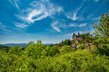 The Majestic and Enigmatic Ruins of an Ancient Castle are Beautifully Surrounded by Lush Greenery