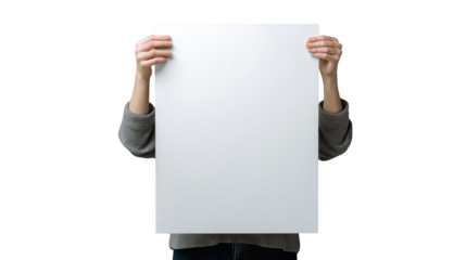 A person is holding a white piece of paper