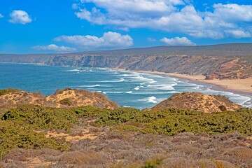 Long sandy Bordeira beach with dunes