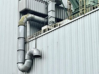 Industrial air filtration and ventilation system on a factory rooftop. Large ducts and exhaust...