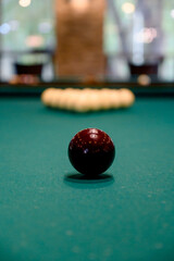 Billiards. Billiard balls on green table and white ball on the foreground